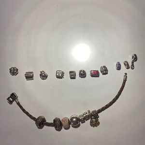 Pandora and non-Pandora charms and brown braided leather Pandora bracelet 7.75”